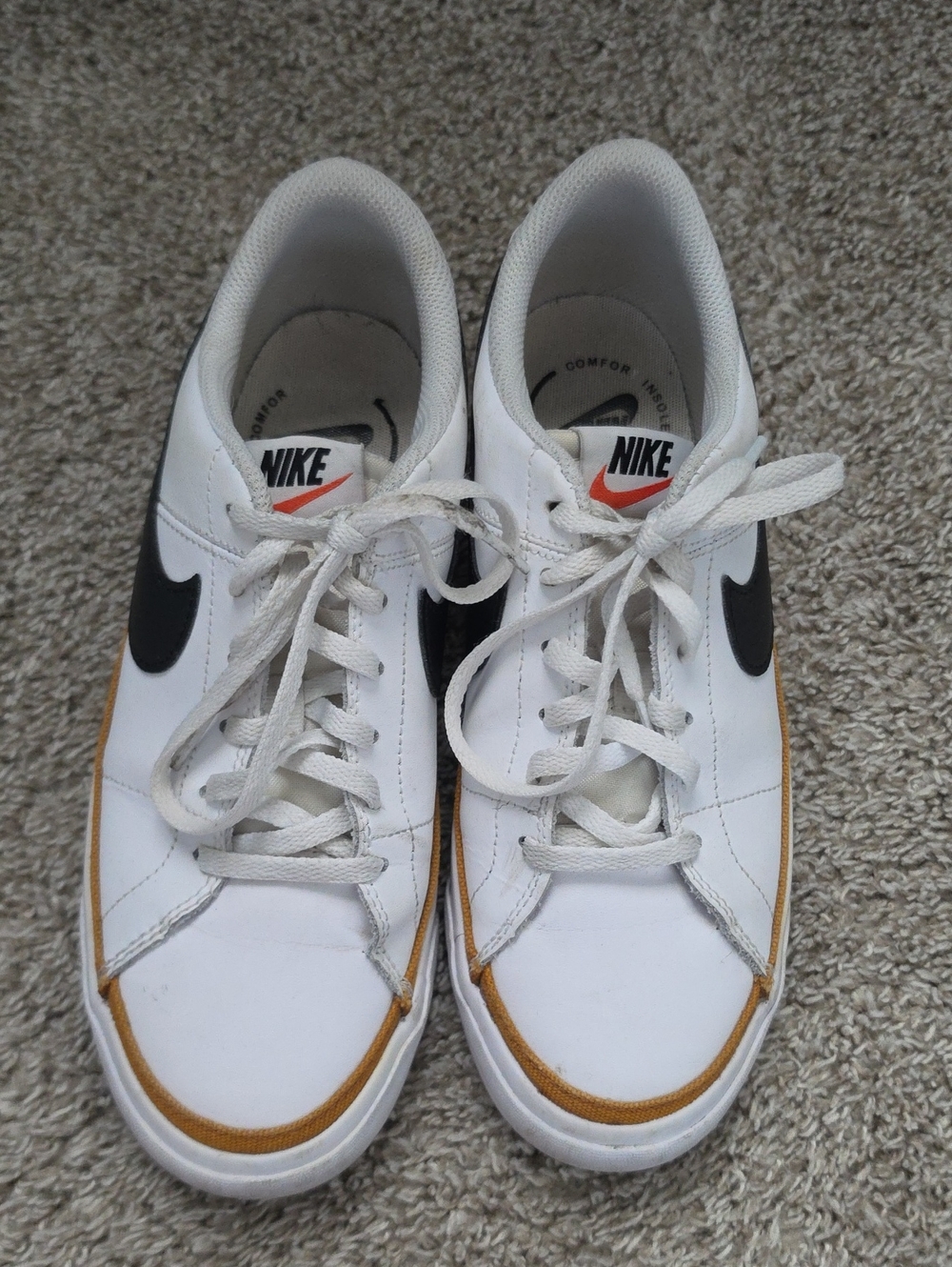 Nike White Leather Sneakers with Black Swoosh and Gum Accent